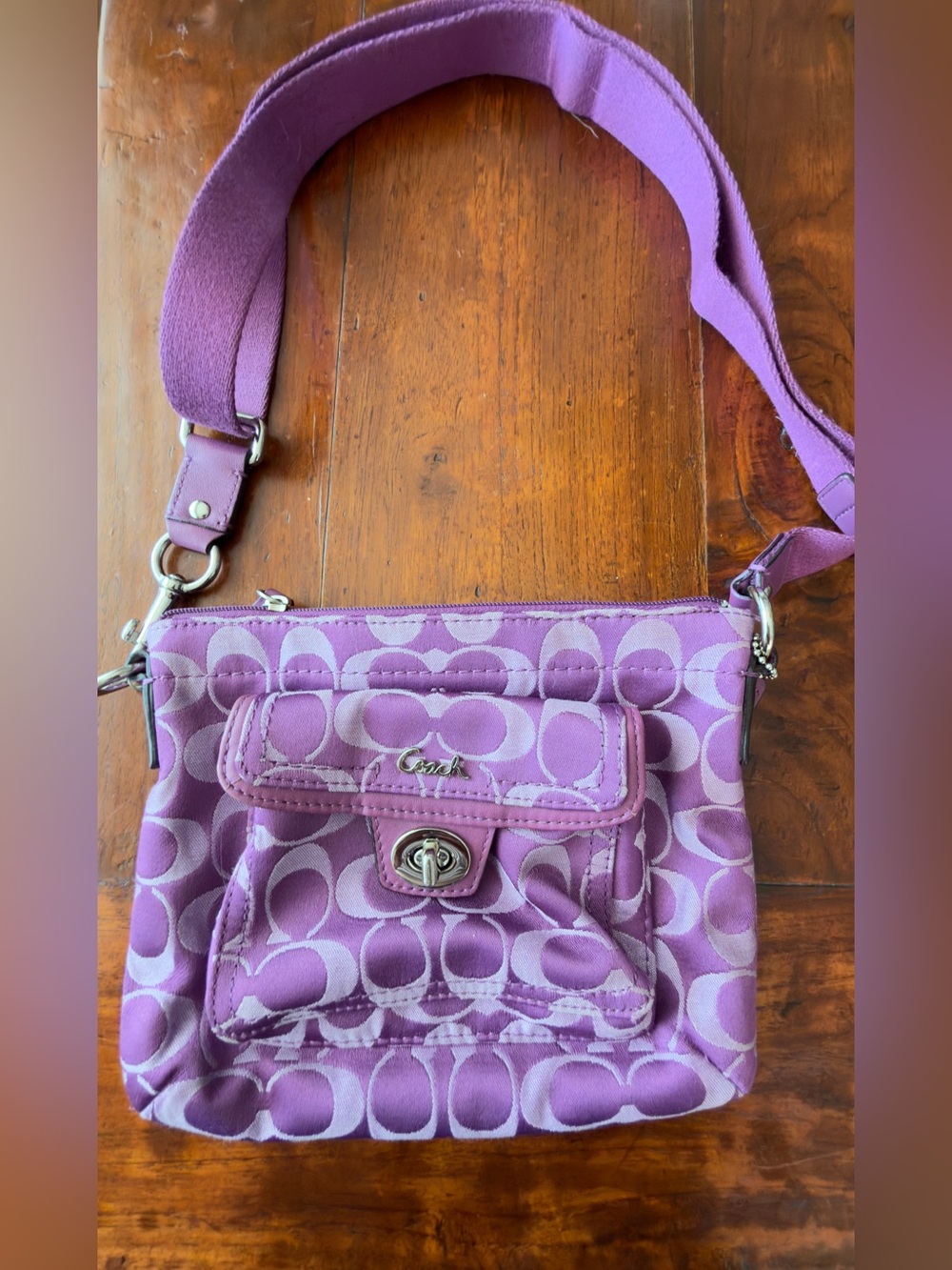 Coach Vintage Y2K Purple Penelope signature swing pack with turn-lock closure.
